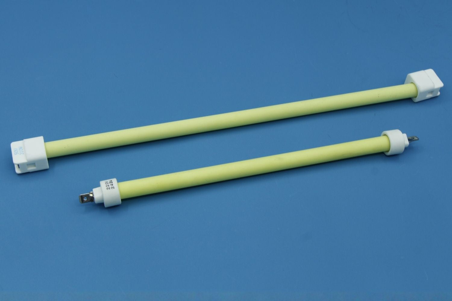 Infrared quartz heating tubes displayed on blue background, showcasing their sleek design and utility.